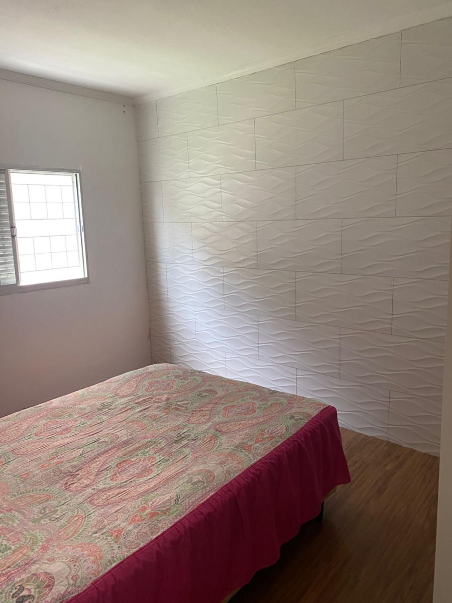 Casa térrea com 2 dormitórios, quintal e cozinha planejada – Vila Lavínia