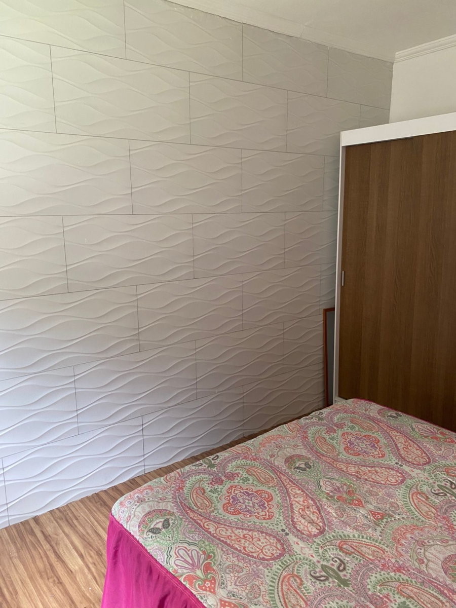 Casa térrea com 2 dormitórios, quintal e cozinha planejada – Vila Lavínia